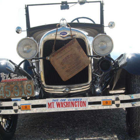 a motorcycle parked in front of a truck
