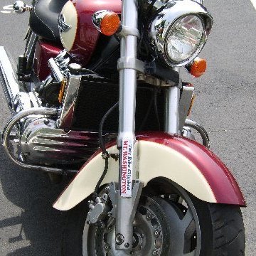 a motorcycle parked on the side of a road