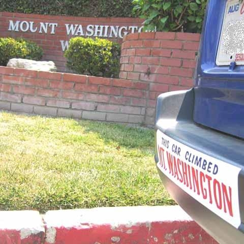 a box that has a sign on a brick building