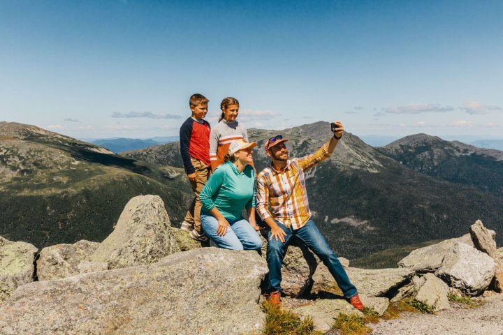 a man standing on a rocky hill