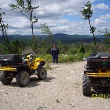 a truck driving down a dirt road