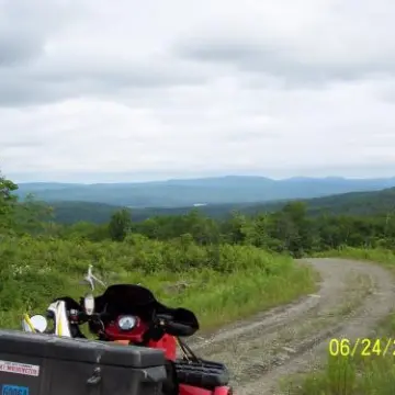 a motorcycle is parked on the side of a road