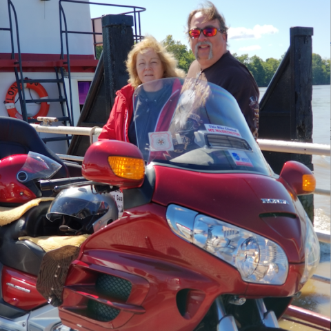 a person riding on the back of a motorcycle