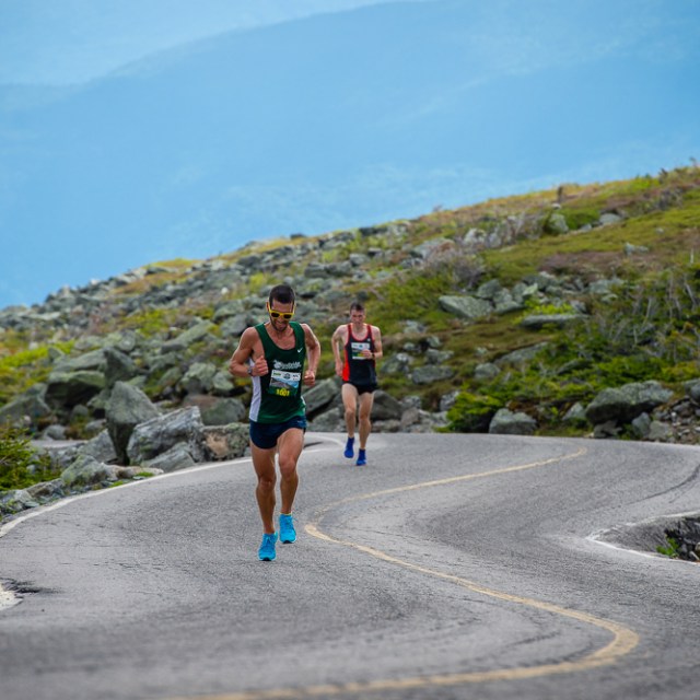 a man walking up a hill
