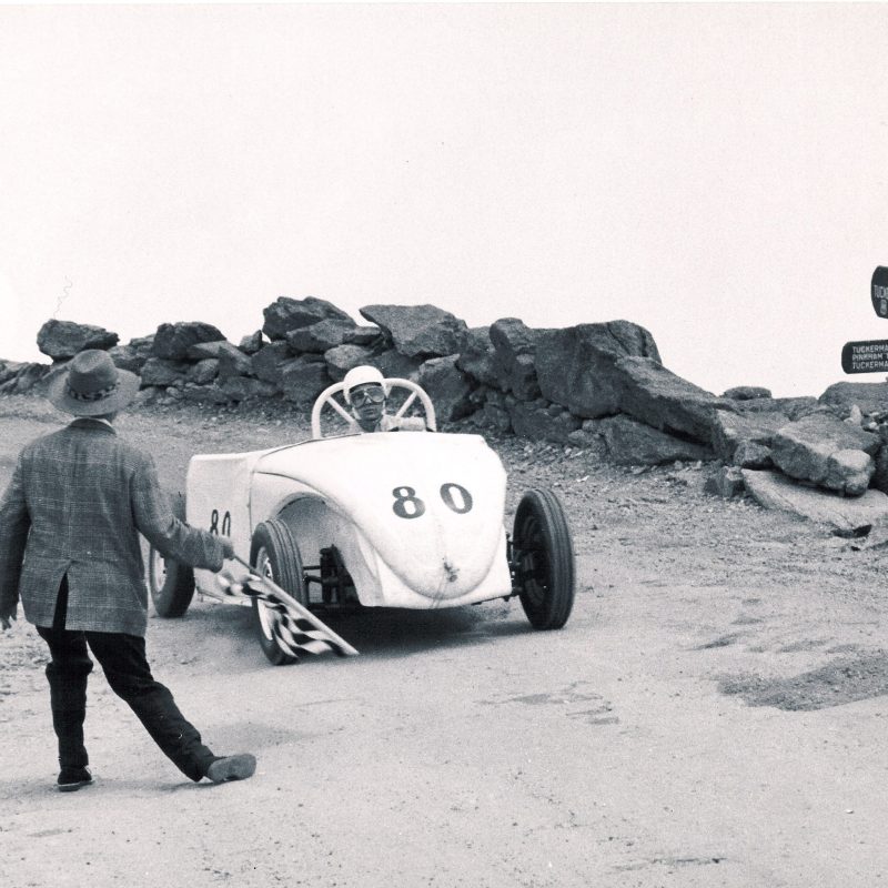 a group of people riding on the back of a truck