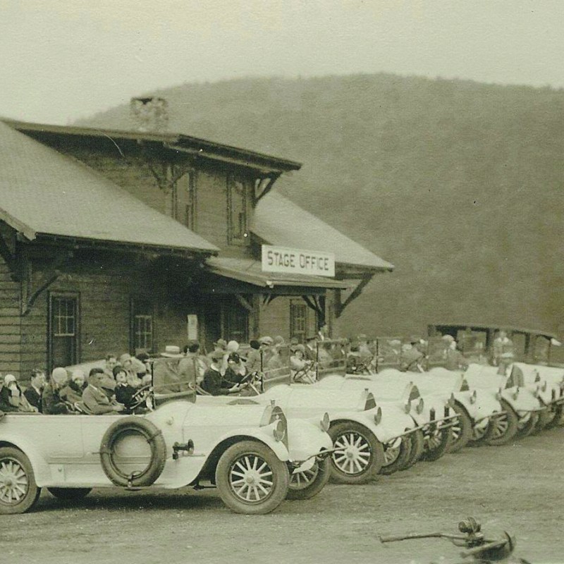 an old car parked in front of a house