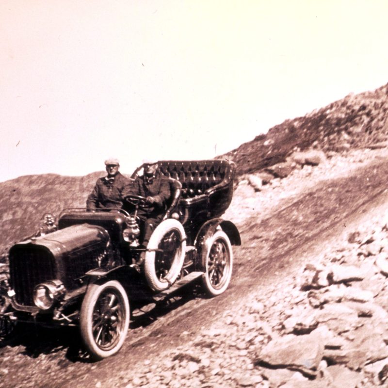 a motorcycle is parked on the side of a mountain