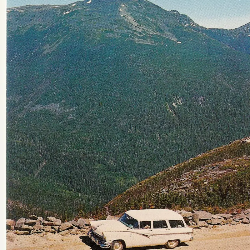a car parked on the side of a mountain