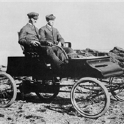 a man riding a horse drawn carriage