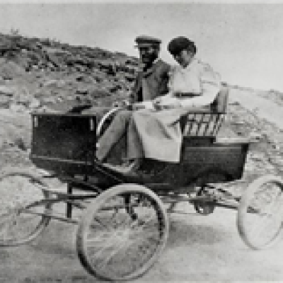 a man riding a horse drawn carriage