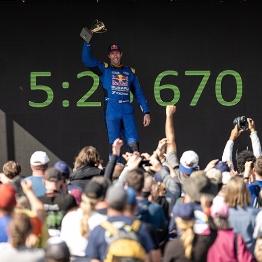 a group of people on a stage in front of a crowd