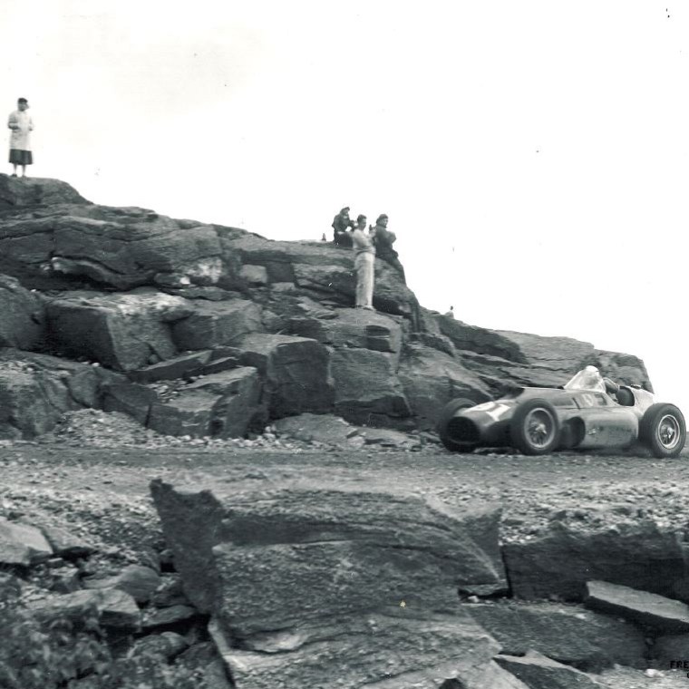 a group of people on a rocky hill