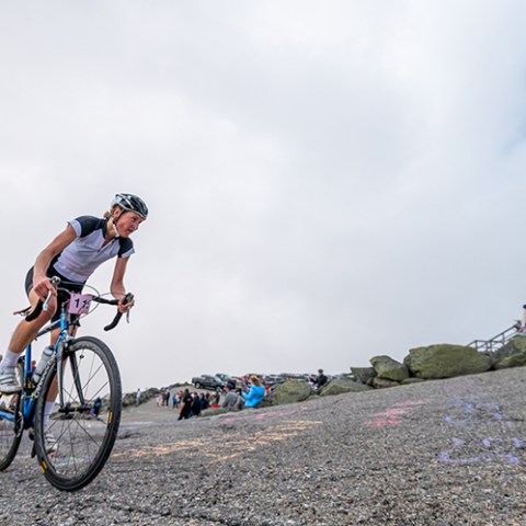 a man riding on the back of a bicycle