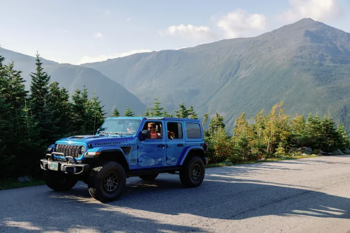a truck with a mountain in the background