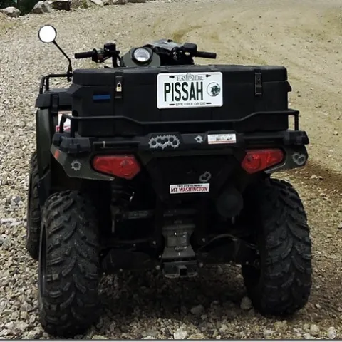a motorcycle parked on the side of a vehicle