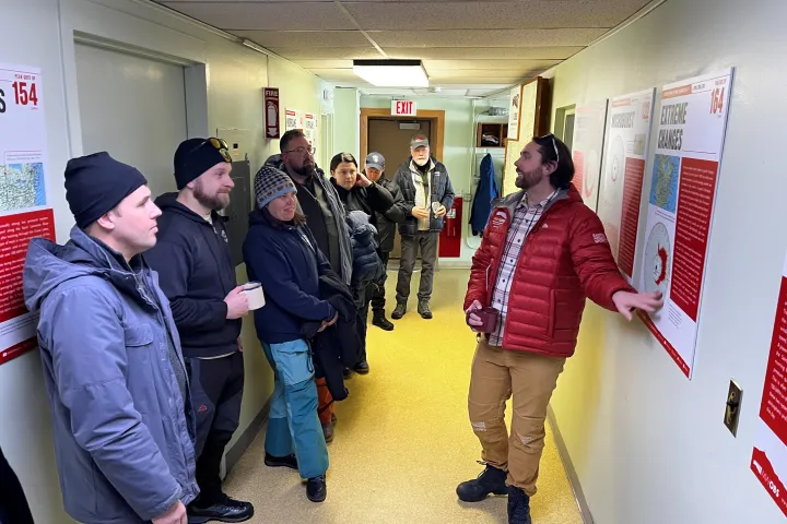 Marc Reichert et al. standing in a room